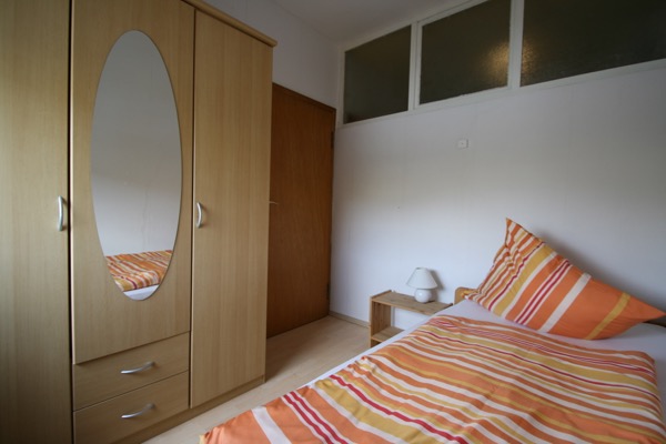 1 van de slaapkamers in de vakantiewoning