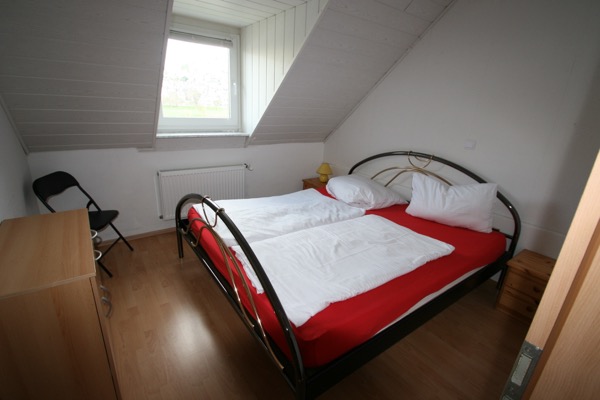 1 van de slaapkamers in de vakantiewoning